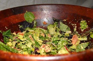 A salad with tomatoes is a potluck dish at Arnold's Way