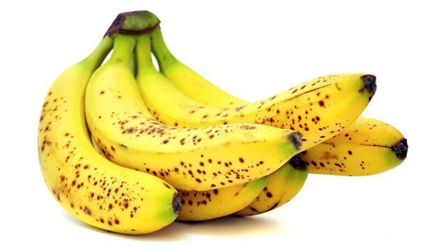 A hand of bananas on a white background