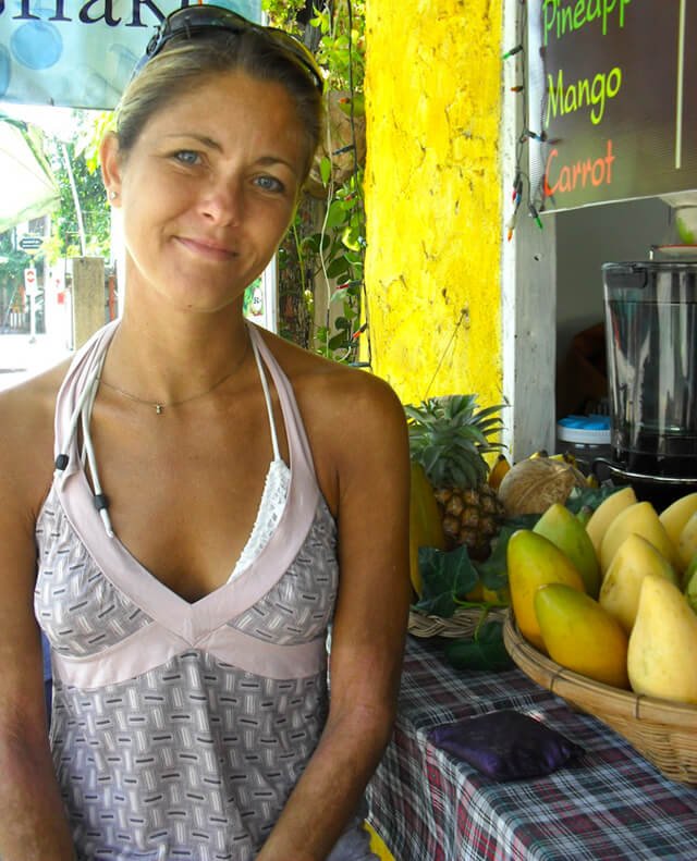 Louise Koch smiles at a smoothie bar