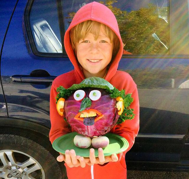 Raw Food Levi holds a cabbage head for a 2014 contest