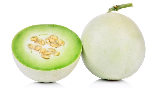 Honeydew whole and halved on white background