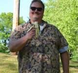 Demetrius eats a banana at Banana Fest