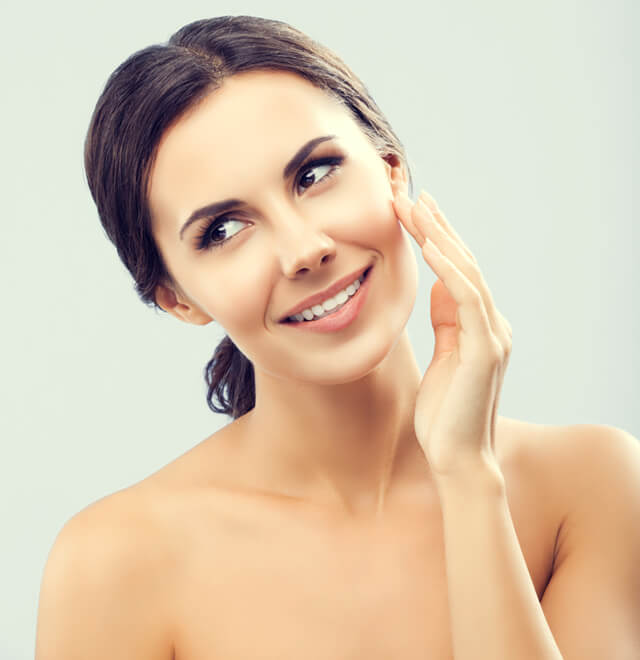 Woman touches face