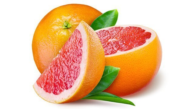Grapefruit with a half and leaves on white background