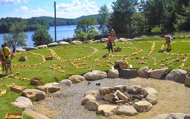 Woodstock Fruit Festival staff members and volunteers spell the festival name using bananas