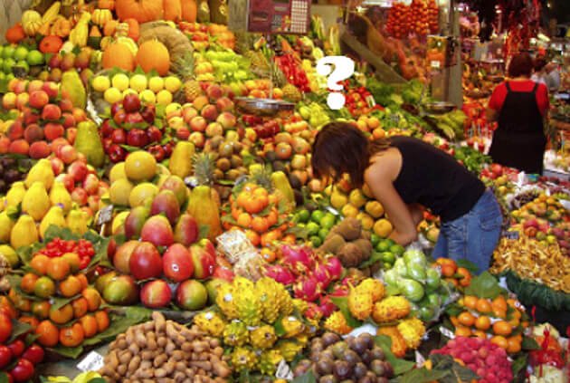A woman shops for fruits