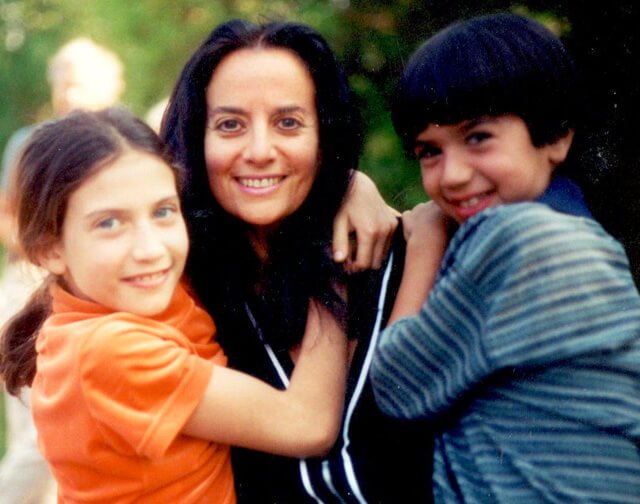 Karen Ranzi hugs her children